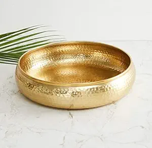 **Alt Text:** "Hammered Flower Urli Bowl – Elegant home decor piece designed for floating tea candles and flowers. Features a unique hammered flower design for a sophisticated touch."